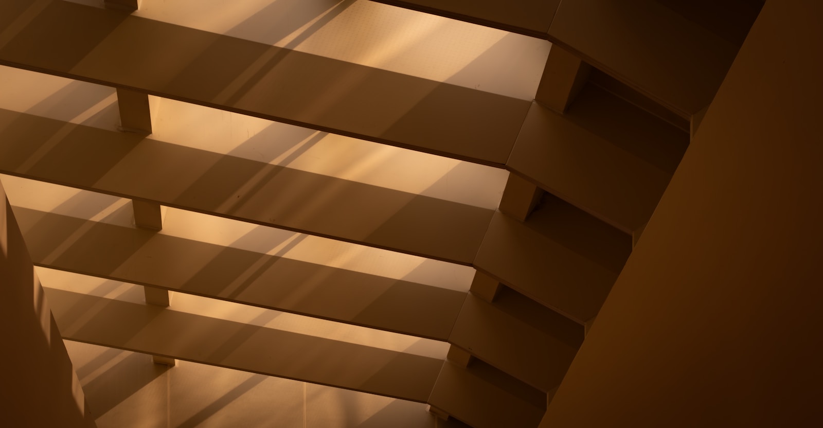 Wooden beams with diagonal light and shadow